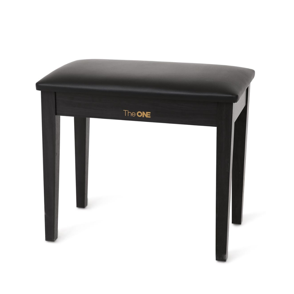 TheONE piano bench with black PU seat and wooden legs set at a keyboard